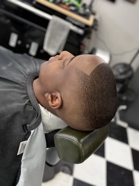 Bald fade with a crisp line-up at Salt City Barber Shop in Liverpool, NY